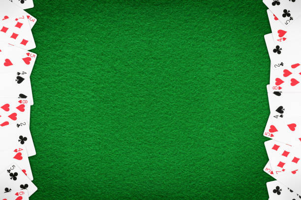 istock Green casino felt table with cards row template 1146529940