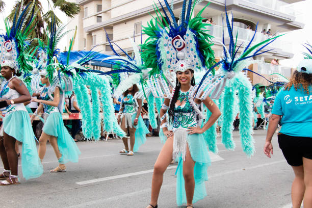 Carnival of Aruba A colorful girl, walking in the parade of the huge carnival of Aruba in Oranjestad. This year the caribbean island celebrated the 65. carnival. showtime stock pictures, royalty-free photos & images