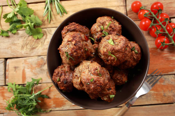 istock Roasted Beef Meatballs garnished with spicy sauce 1146531516
