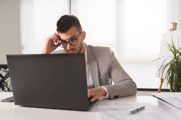 istock Businessman sitting on his office desk. Work stress. 1146532930