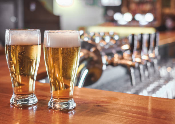 istock Two  Glasses of Beer on a bar table. 1146534278