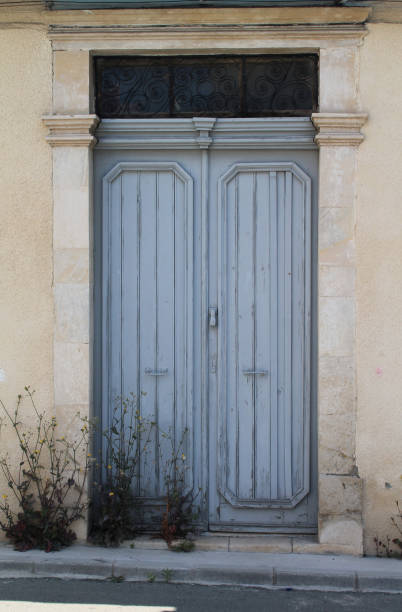 istock Vintage wooden front door in stone wall 1146535479