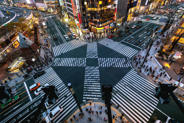 Aerial view of intersection in Ginza, Tokyo, Japan at night. Aerial view of intersection in Ginza, Tokyo, Japan at night. shibuya district stock pictures, royalty-free photos & images