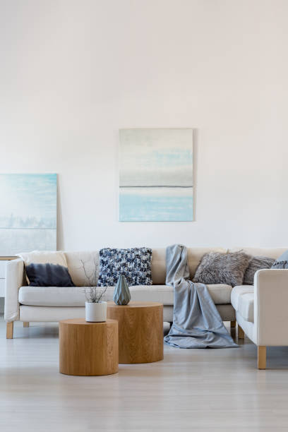 istock Two paintings in elegant living room interior with corner sofa and coffee table 1146540915