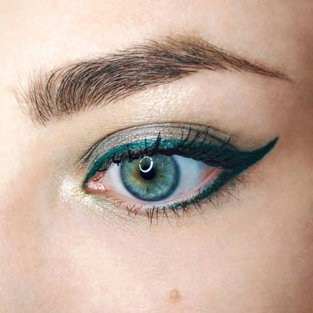 Blue eye gold green arrow eyeliner make-up eyebrow lash cosmetic swatch fashion macro photo Blue eye gold green arrow eyeliner make-up eyebrow lash cosmetic swatch fashion macro photo. eyeliner stock pictures, royalty-free photos & images