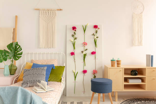 istock White handmade macrame above single metal bed with colorful pillows and doted bedding in fashionable boho bedroom interior 1146542311