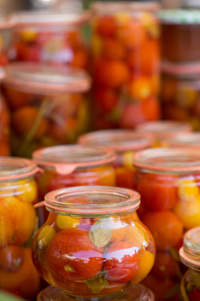 Bottled or preserved tomatoes in glasses