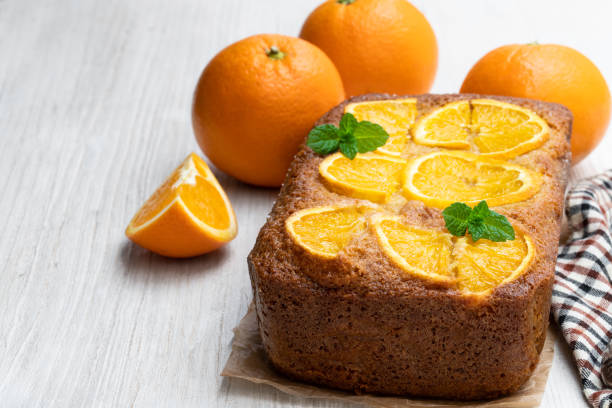 Homemade orange syrup cake isolated on white
