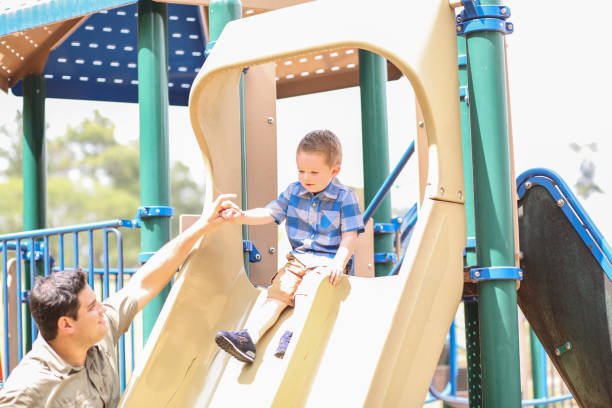 istock Little boy, father playing at local park. 1146545148