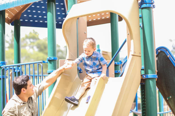 istock Little boy, father playing at local park. 1146545222