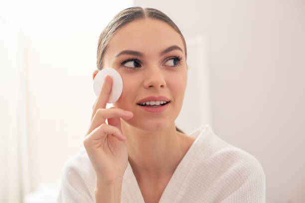 istock Thoughtful lady looking into the distance and holding cotton pad 1146547928