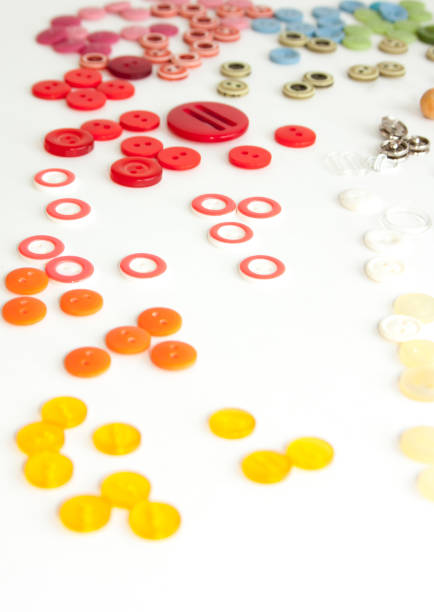istock Flat lay with colorful sewing buttons, mock up, top view. Layout buttons mockup on blank white background for needlework, sewing, embroidery poster, banner. Empty space for text. 1146548089