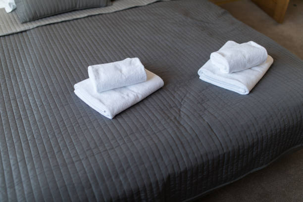 istock White towel on bed decoration interior of bedroom. 1146548381