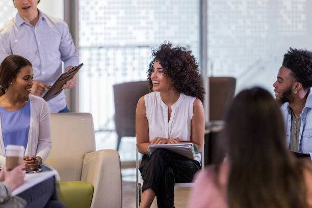 istock Cheerful therapist leads support group meeting 1146552582