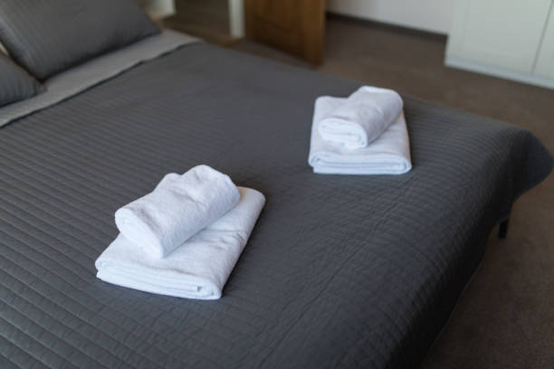 istock Clean towel on bed in modern interior bedroom. 1146552721