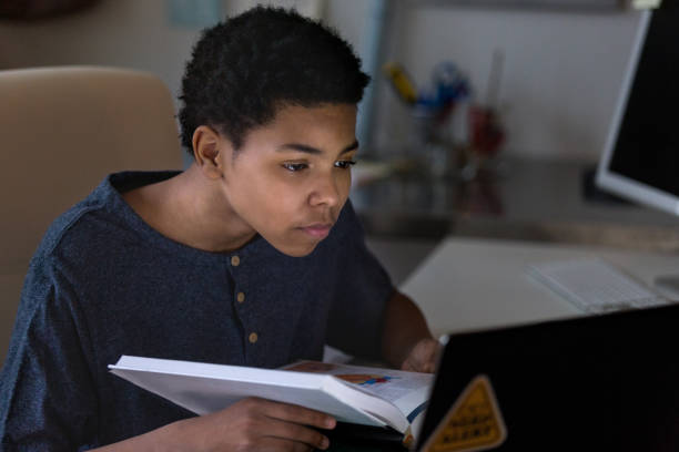 istock Teen boy studies for exam at night 1146552972