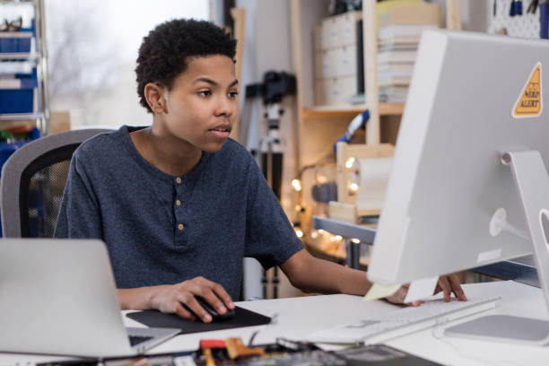 istock Teen boy plays video game on home computer 1146553000