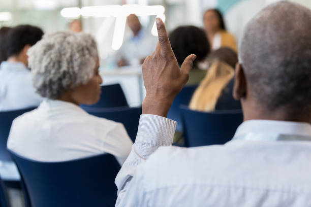 istock Mature African American man questions speaker 1146553415