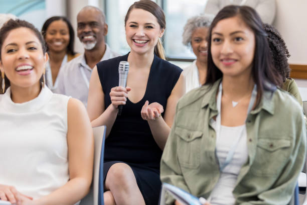 istock Diverse colleagues enjoy speaker after seminar 1146553424