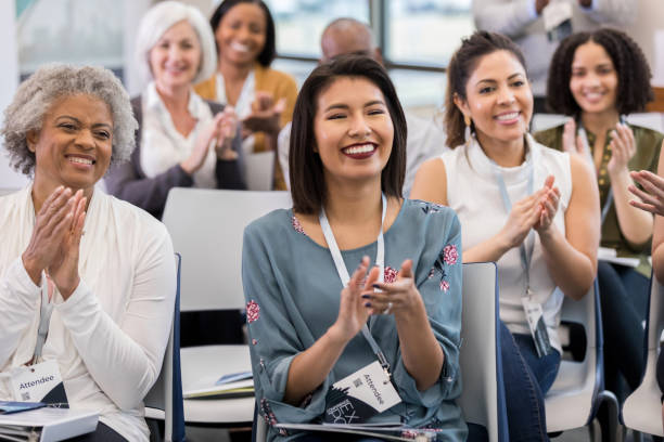 istock Diverse group applauds speaker at conclusion of Q and A 1146553445