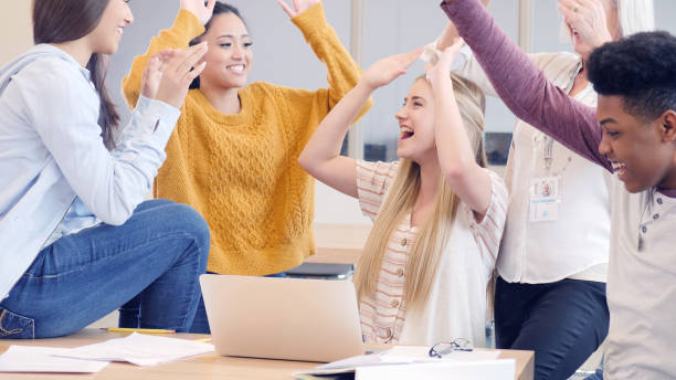 istock High fives all around for successful presentation 1146554315