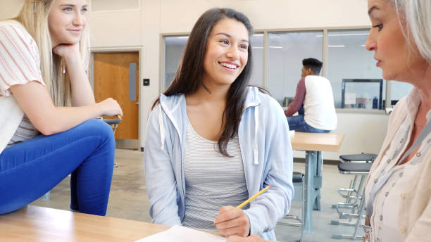 istock Teens listen as Caucasian teacher gives advice 1146554331