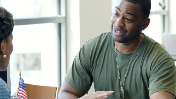 istock Serious military solider talks with banker about a loan 1146554622