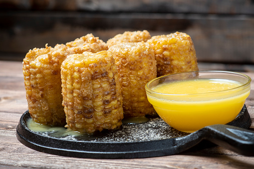 fried corn on the cob with butter