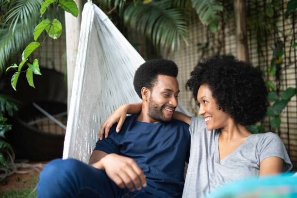 istock Young couple lying down in hammock outdoors 1146556956