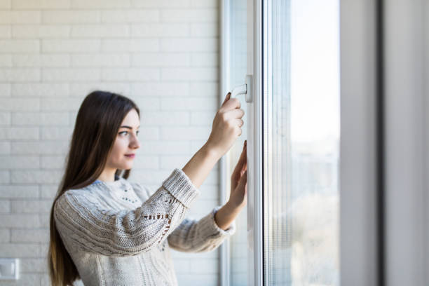 istock Young woman opening new modern window, closeup view 1146558213