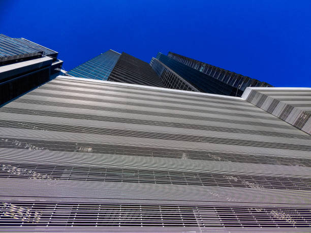istock Big business building from below with blue sky 1146561296