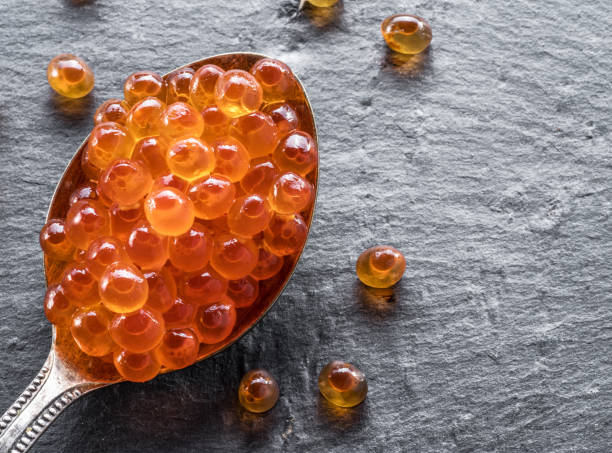 istock Silver spoon of red caviar. 1146562223