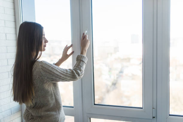 istock Young woman opening new modern window, closeup view 1146563213