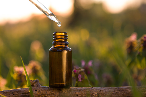 Organic bio alternative medicine, amber bottle.