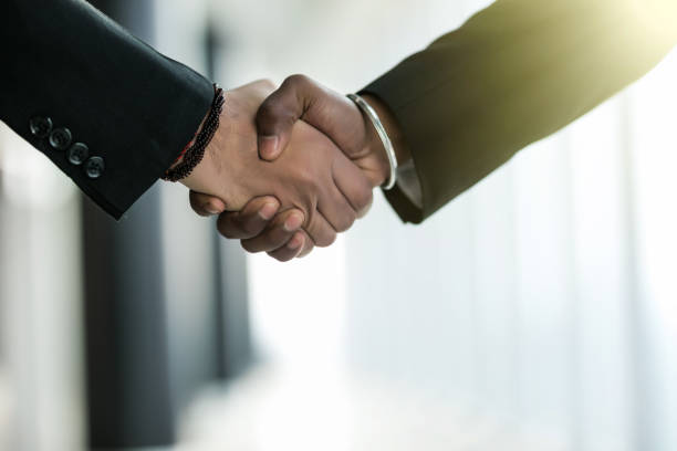istock Business shaking hands in front of modern building with copy space 1146565150