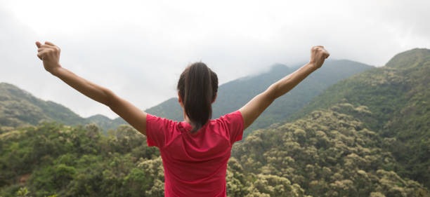 istock young woman  feel strong at forest mountain top 1146571524