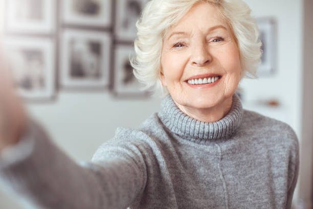 istock Elderly woman photographed her face, toothy smiling 1146576607