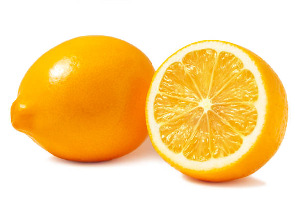 istock Fresh orange Tashkent lemons or Meyer lemons, one whole and one half isolated on white background with shadow 1146580694