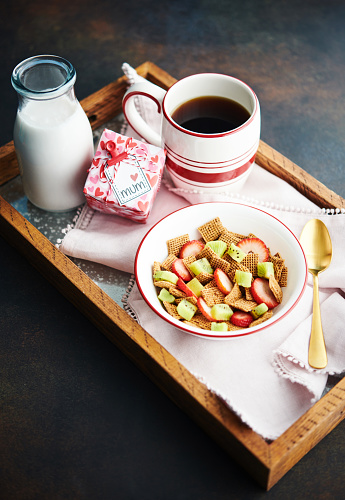 Breakfast cereal with strawberries and kiwi fruit - Mother's Day theme