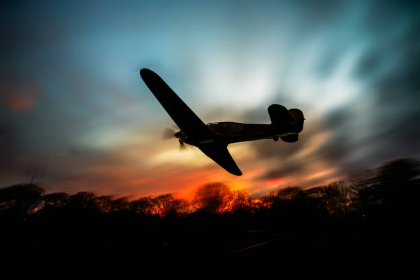 istock WW2 Airplane Silhouetted Against Sky 1146587000