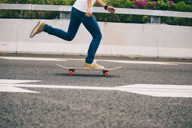 istock Skateboarder skateboarding  on city road 1146588551