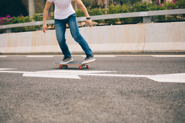 istock Skateboarder skateboarding  on city road 1146588640