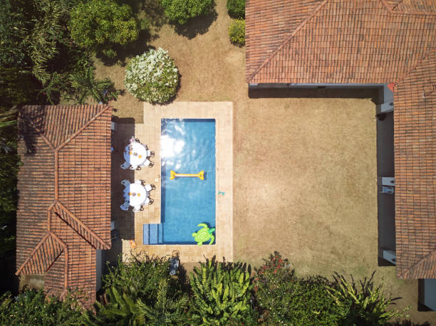 house backyard with swimming pool house backyard with swimming pool above drone view on sunny day competition group stock pictures, royalty-free photos & images