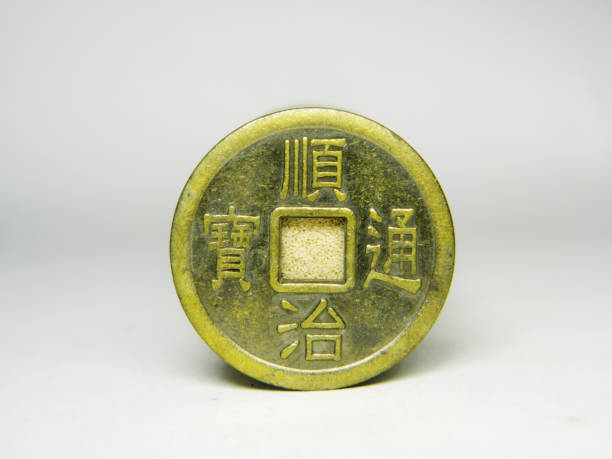 istock Ancient bronze coins of China on over white 1146601379