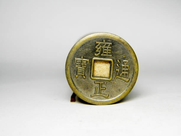 istock Ancient bronze coins of China on over white 1146603007