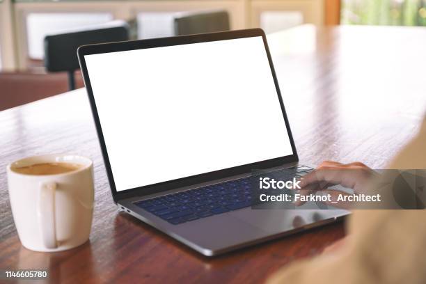 A Womans Hand Using And Touching On Laptop Touchpad With Blank White Desktop Screen Stock Photo - Download Image Now