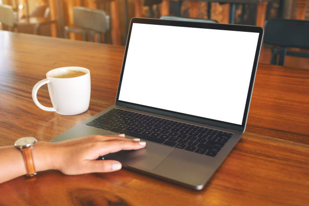 istock a woman's hand using and touching on laptop touchpad with blank white desktop screen 1146605821