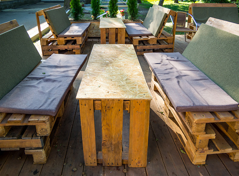 Voronezh, Russia - August 20, 2018: Furniture for outdoor cafes from old pallets