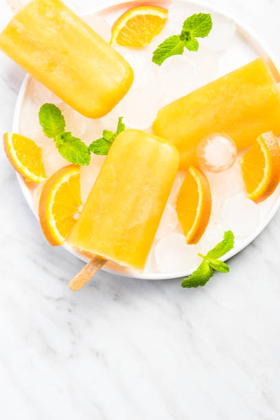 istock Homemade popsicles made from orange juice 1146607933
