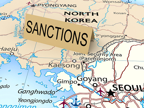 Sanctions paper card on map of Noth Korea. As background used CIA Map that are in the public domain https://www.cia.gov/library/publications/resources/cia-maps-publications/SouthKorea.html